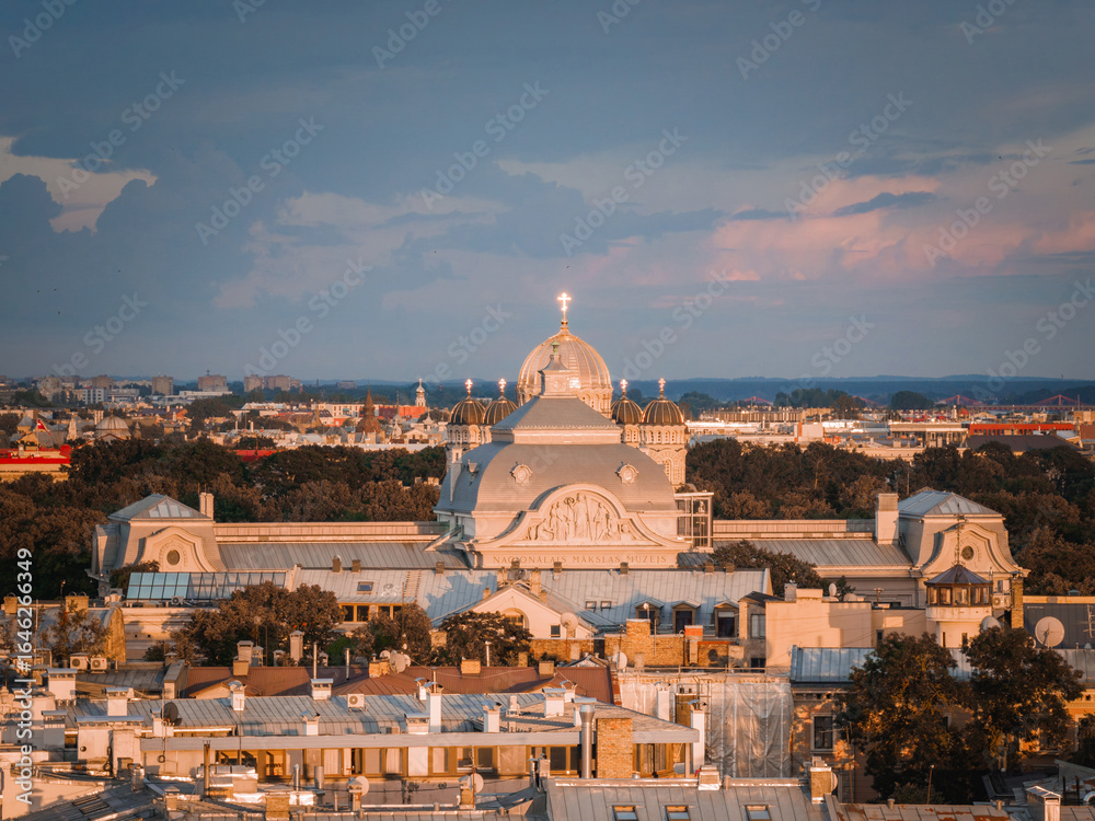 Fototapeta premium Riga, Latvia, at sunset featuring a The Nativity of Christ Cathedral in Riga, Latvia as well as National art museum.