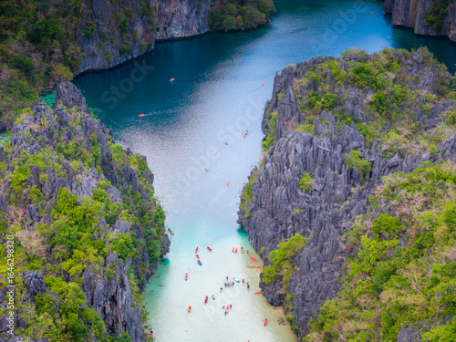 Big Lagoon and Small Lagoon at Miniloc Island near El Nido, Palawan, Philippines. Aerial 4K drone video footage of crystal clear lagoon