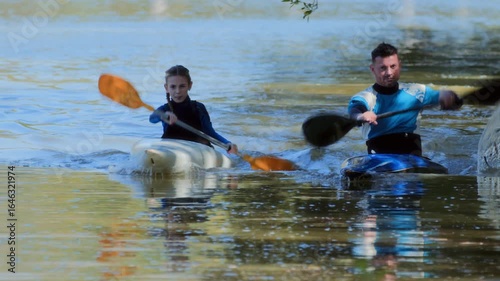 Father and Child Kayaking Together on the Water