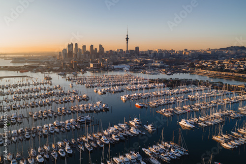Fototapeta Naklejka Na Ścianę i Meble -  Sunset aerial panorama of Auckland marina and city skyline