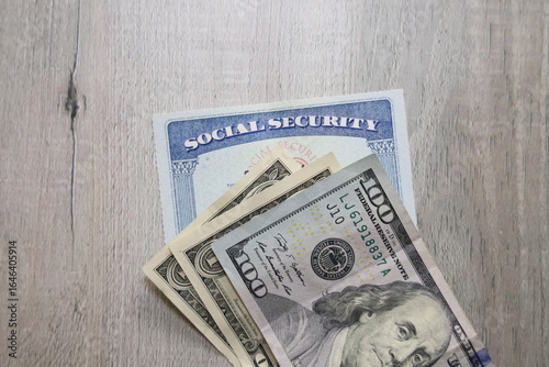 Social security card a US bills. Income at retirement concept.