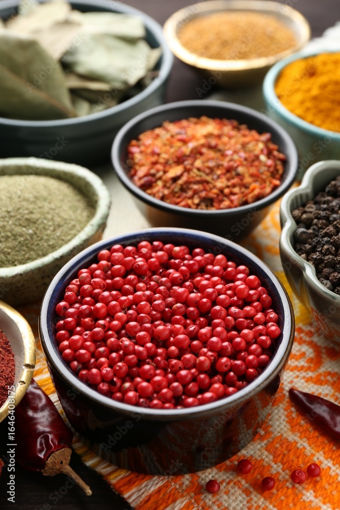 Different aromatic spices on orange tablecloth, closeup Different aromatic spices on orange tablecloth, closeup