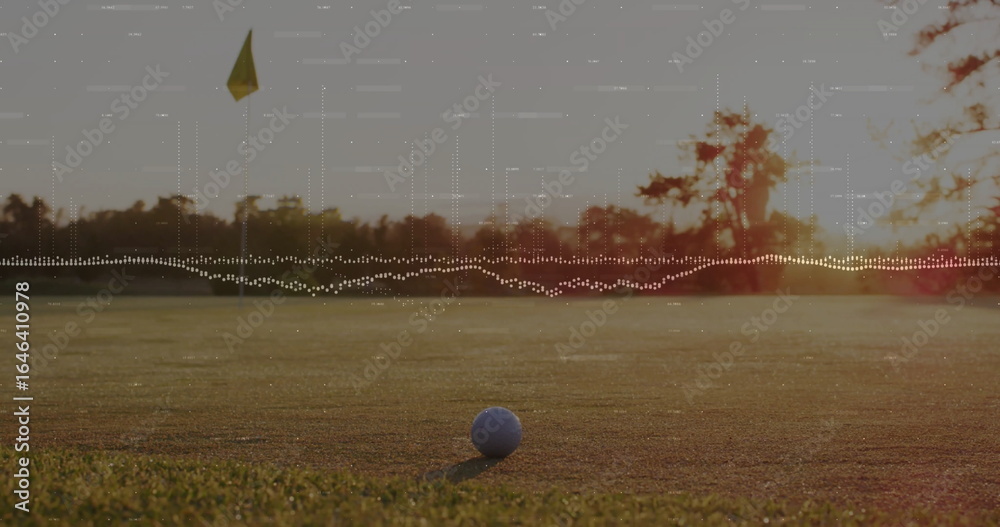 Fototapeta premium White golf ball sitting on putting green at sunset, with yellow flag hole, audio waveform overlay