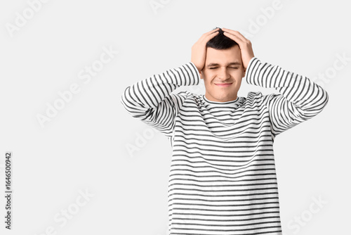 Young man suffering from he...