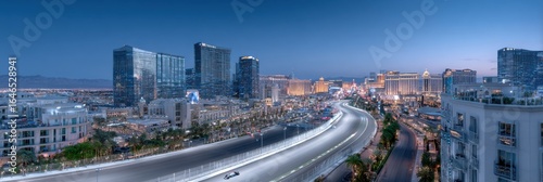 City skyline illuminated at twilight showcasing Las Vegas Strip and flowing traffic