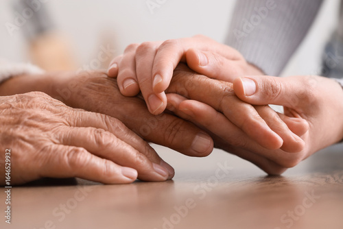 Young woman holding grandmo...