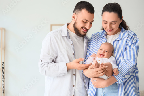 Young parents with their li...