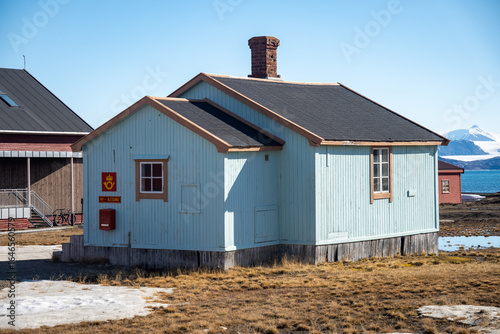 Post office in a light blue building in Ny Alesund, Svalbard, Norway