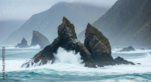 Crashing Waves Against Jagged Sea Stacks in Misty Landscape