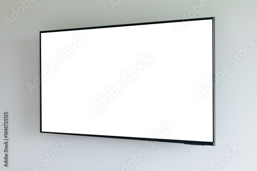 Blank flat screen TV mounted on wall with white screen
