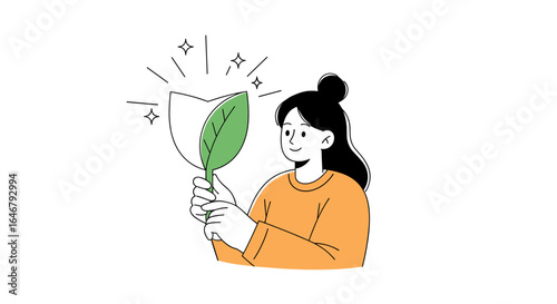 Young woman holding a fresh green leaf reflecting nature's beauty and purity