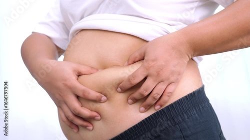 Wallpaper Mural Asian woman use hand to squeeze fat belly big size overweight and obesity. Torontodigital.ca