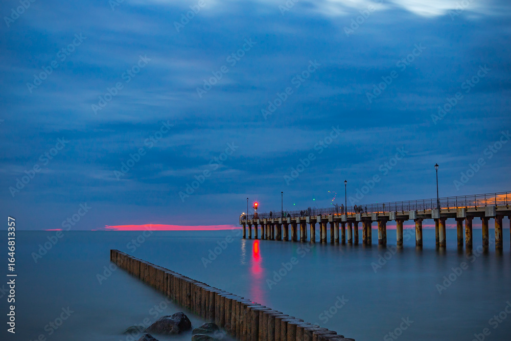 Obraz premium Pier in the evening after sunset in the Baltic Sea