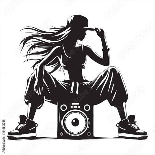 Silhouette of a female hip hop dancer sitting on a speaker with a baseball cap and flowing hair breakdance