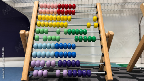 Photos Colorful abacus beads echo ancient numeracy wisdom, International Numeracy Day,