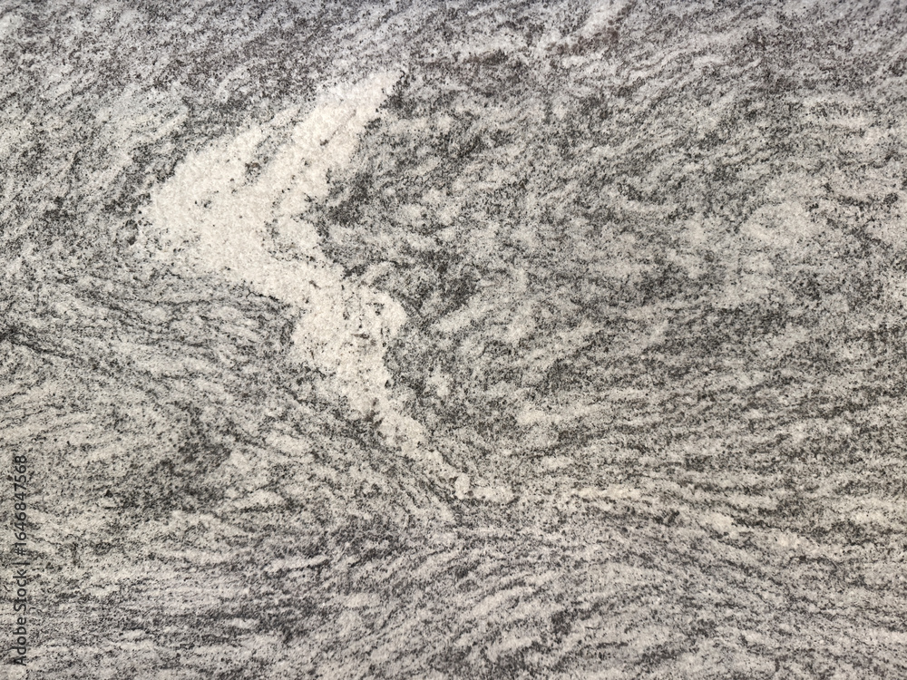 Naklejka premium Natural grey marble with random abstract texture. Luxurious rare type of grey natural marble stone with dark black veins, Seamless background texture.