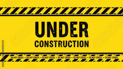 Under Construction sign on yellow background with hazard stripes