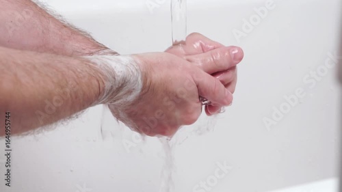 Man washing his hands. Hygiene. Cleaning Hands. Washing hands with soap. Body hygiene concept