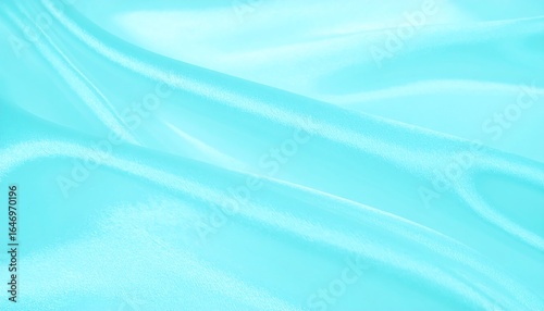 Soft, flowing light teal fabric with subtle folds and ripples