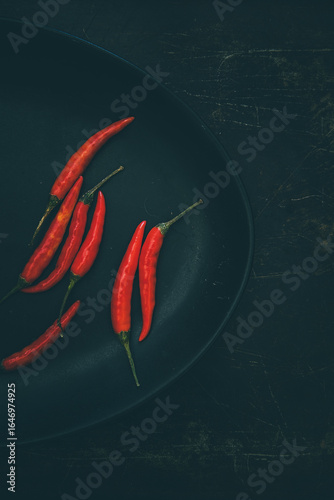 Tabasco chilies on a metal tray background