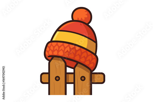 Knitted cap resting on wooden fence in vibrant colors wool hat on fence