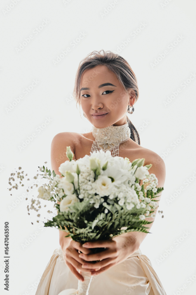 Beautiful young asian bride in elegant white dress showcasing her radiant smile Beautiful young asian bride in elegant white dress showcasing her radiant smile