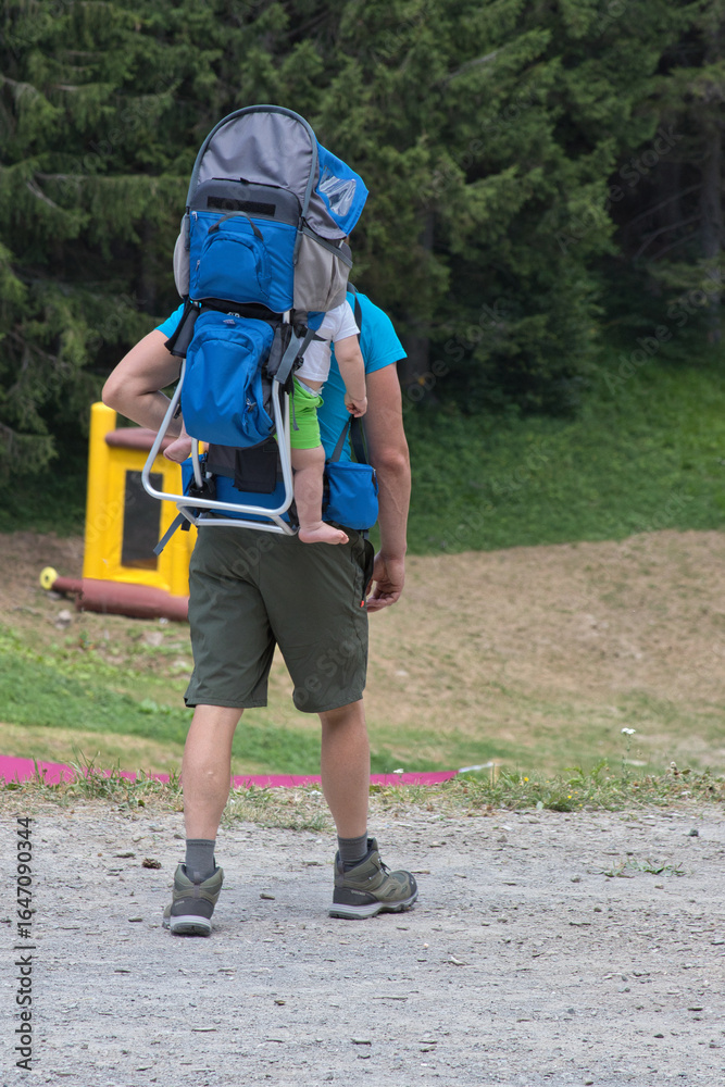Fototapeta premium father and son hiking in the mountains
