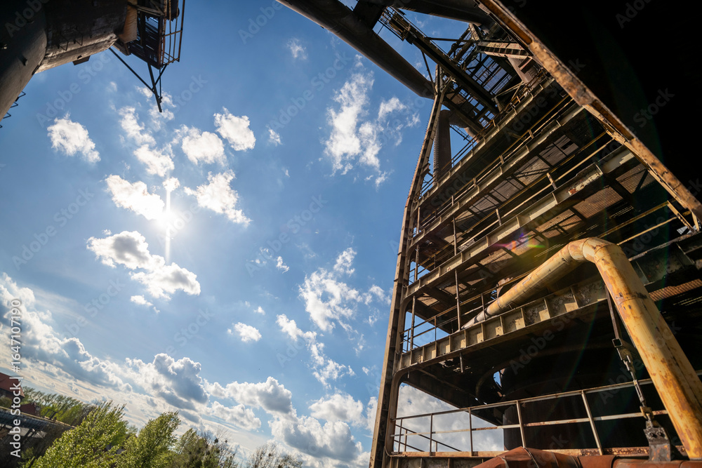 Fototapeta premium Abandoned Heavy Industrial Ruins with Large Blast Furnace in Steelworks