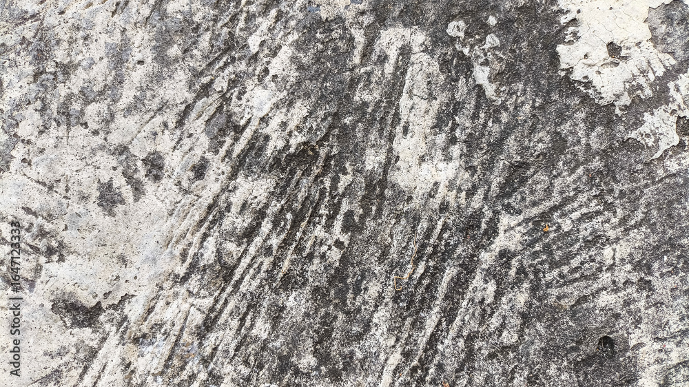 Fototapeta premium Cracked and dirty cement wall with erosion marks and surface wear. Grunge style for damaged architecture textures.