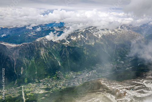 Scenic stormy clouds over Chamonix resort, seen from Aiguille du Midi Peak 93842m), Mont Blanc, Haute Savoie, France, Europe