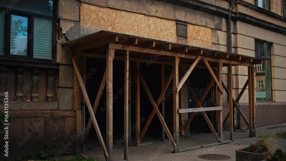 An Abandoned Buildings Entrance Featuring a Wooden Support Structure and Rustic Appeal in Urban Settings An Abandoned Buildings Entrance Featuring a Wooden Support Structure and Rustic Appeal in Urban Settings