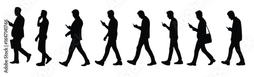 man walking while using a smartphone silhouettes