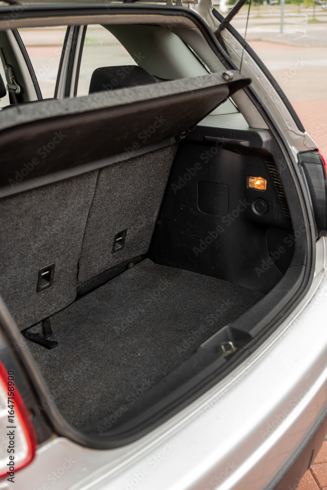 Obraz premium Open trunk in a black textile car