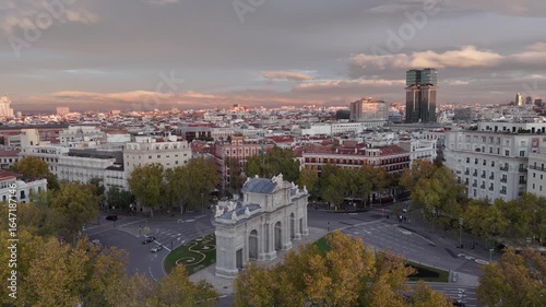Aerial view of the Puerta de Alcalá monument, the old buildings, and the autumn trees, showcasing a stunning cityscape, Madrid, Comunidad de Madrid, Spain.