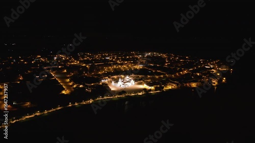 Orbital drone at night, El Rocio catholic church. On the waterfront.