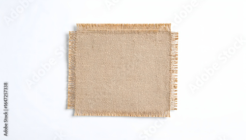 Natural linen fabric swatches, two stacked rectangular pieces with frayed edges, rustic texture on white.