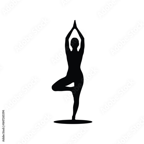 Silhouette of a person in a yoga tree pose