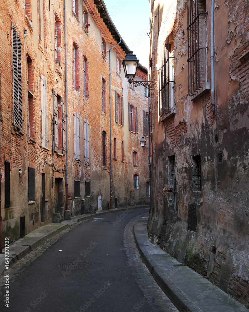Fototapeta premium Typical narrow street of Toulouse city in the south of France