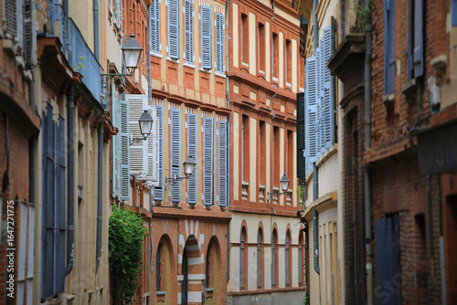 Typical narrow street of Toulouse city in the south of France