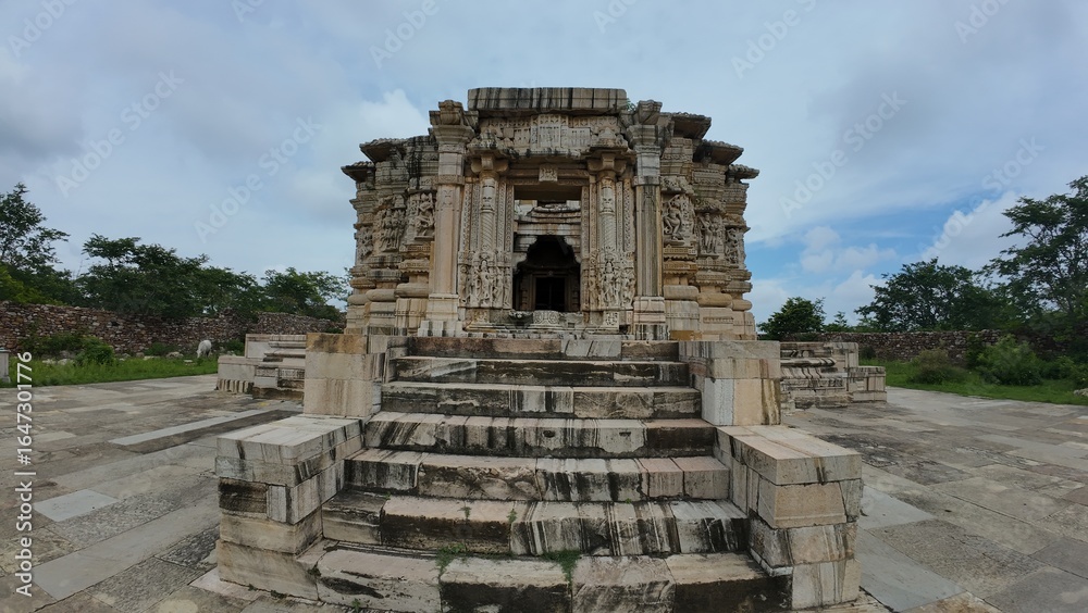 Naklejka premium Ancient Ruined Temple with Detailed Carvings and Stone Reliefs in Chittorgarh Fort Heritage Complex Rajasthan