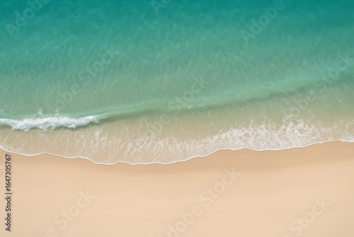 Aerial view of tropical beach with turquoise waves and golden sand, minimal summer seascape background
