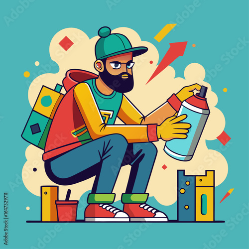 A man with a beard and a green hat is holding a spray can. He is sitting on the ground and he is in a contemplative mood