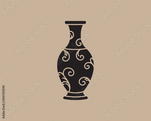 Elegant black vase with swirling white floral ornate design on beige background