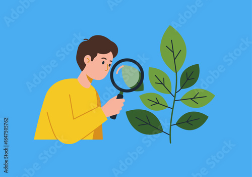 A young person examines a plant leaf with a magnifying glass, studying nature.