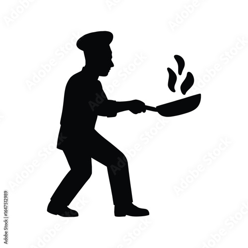 Silhouette of a professional chef cooking with a pan and flames in a restaurant kitchen.