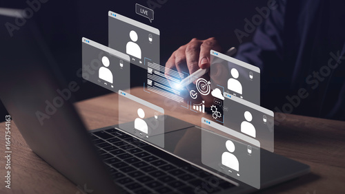 Photos Hybrid work concept featuring a business person interacting with digital analytics during an online video conference