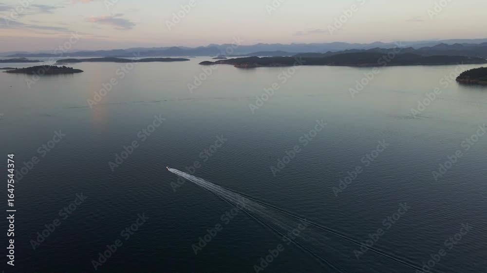 Aerial Drone View of Norwegian Fjord at Dusk with Blue Skies Aerial Drone View of Norwegian Fjord at Dusk with Blue Skies