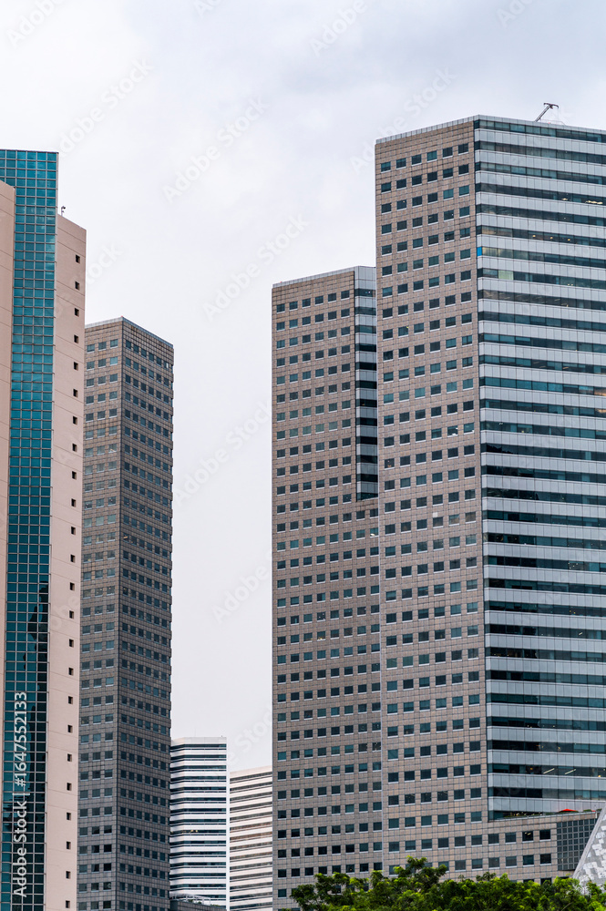 Cluster of modular skyscrapers with repetitive pattern of square windows, Singapore, Asia Cluster of modular skyscrapers with repetitive pattern of square windows, Singapore, Asia