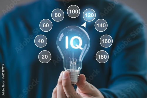 A person holds a light bulb displaying 