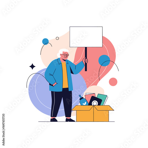 Elderly person holds sign next to packed box of belongings